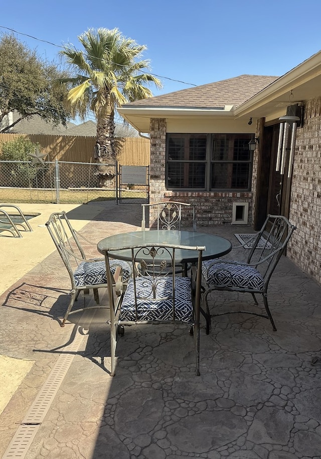 view of patio / terrace with outdoor dining area and fence