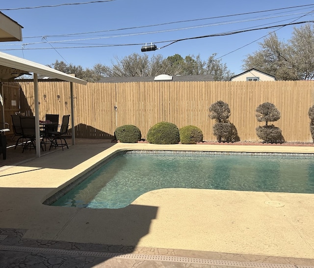 view of pool with a fenced in pool, a patio, and a fenced backyard