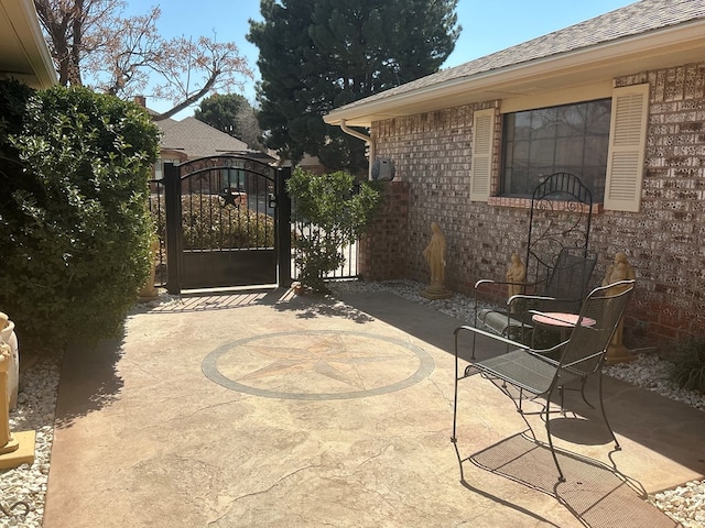 view of patio / terrace with a gate