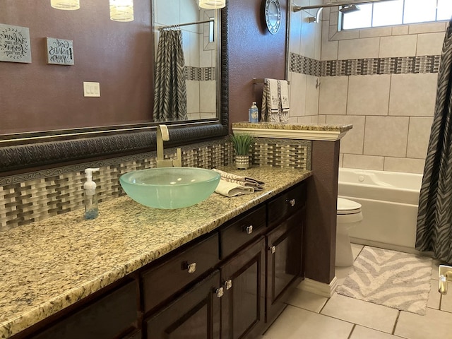 bathroom featuring tile patterned floors, shower / tub combo, toilet, and tasteful backsplash