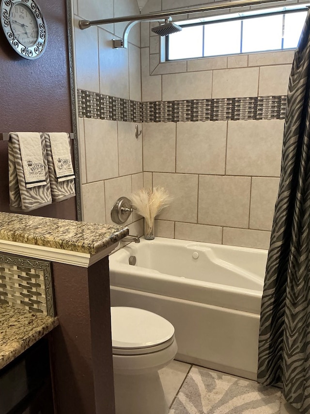 full bath featuring toilet, shower / tub combo, a textured wall, tile patterned floors, and vanity