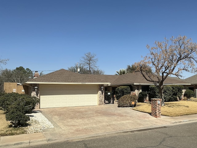 single story home with a garage, driveway, and roof with shingles