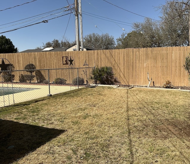 view of yard with a fenced backyard