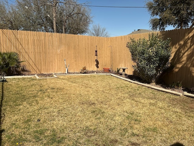 view of yard featuring a fenced backyard