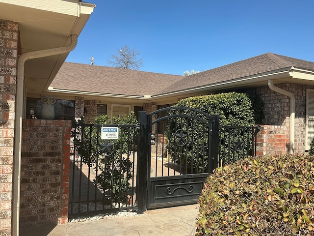 view of gate featuring fence