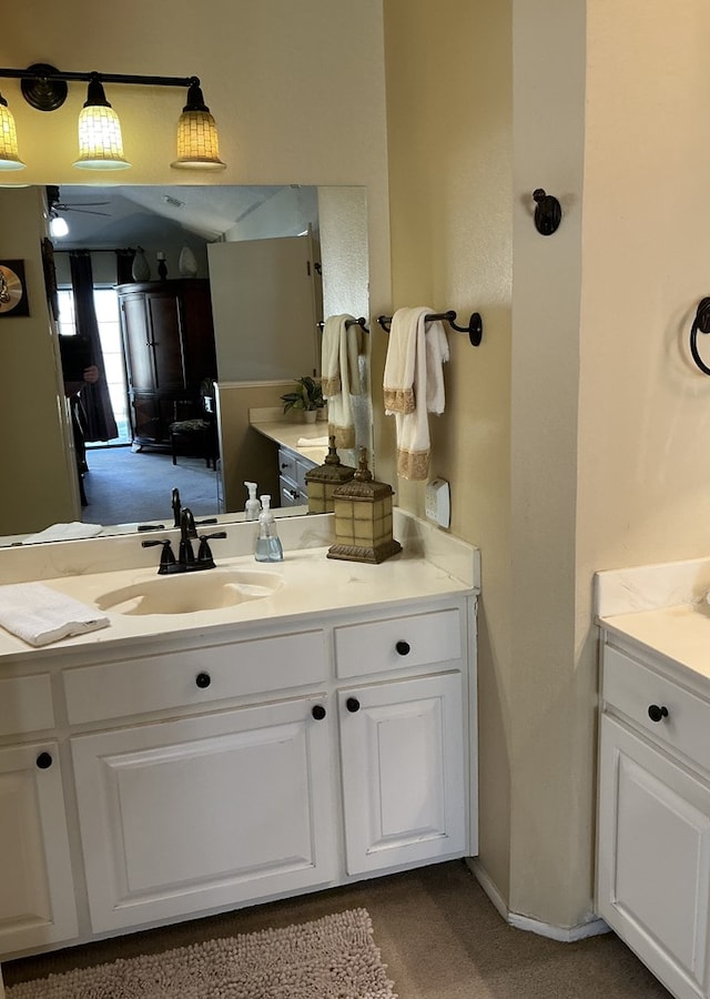 bathroom featuring vanity and baseboards