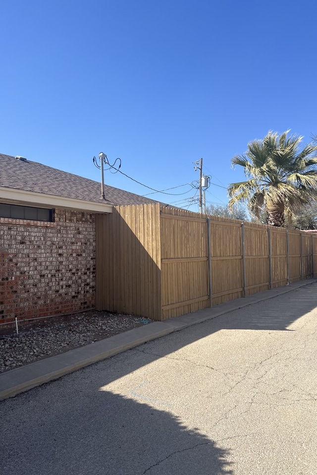 view of gate featuring fence