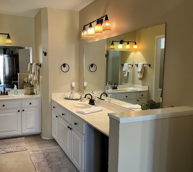 full bath with two vanities and a sink