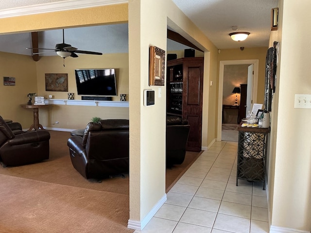 corridor with light tile patterned floors, light colored carpet, and baseboards