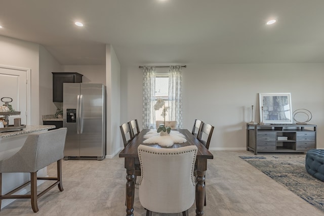 dining room featuring light carpet