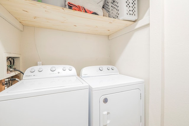 washroom featuring washing machine and dryer