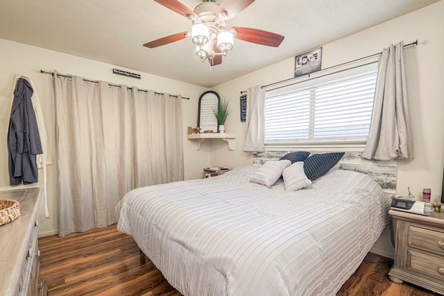 bedroom featuring dark wood-type flooring and ceiling fan