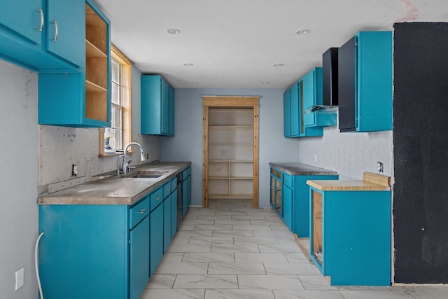 8528 W 24th St, Odessa, TX 79763 - kitchen with wall chimney range hood, blue cabinetry, open shelves, and light marble finish floors