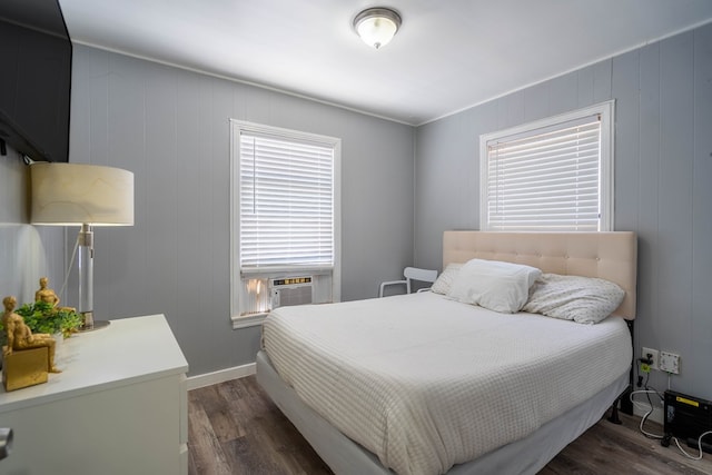 2707 Eisenhower Rd, Odessa, TX 79762 - bedroom with dark wood finished floors and cooling unit