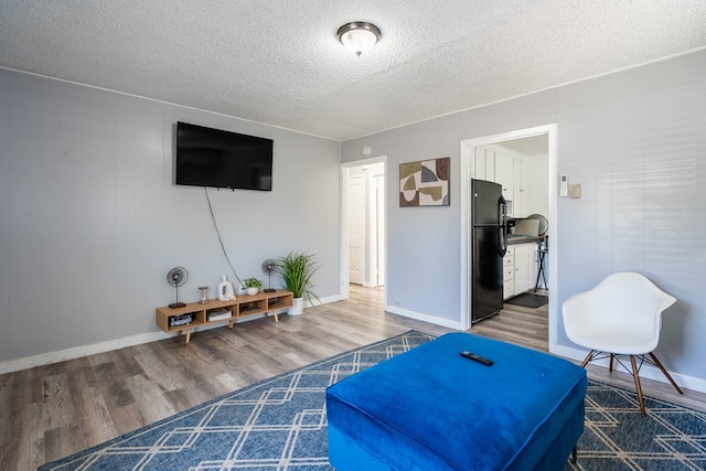2707 Eisenhower Rd, Odessa, TX 79762 - living room with a textured ceiling and wood finished floors