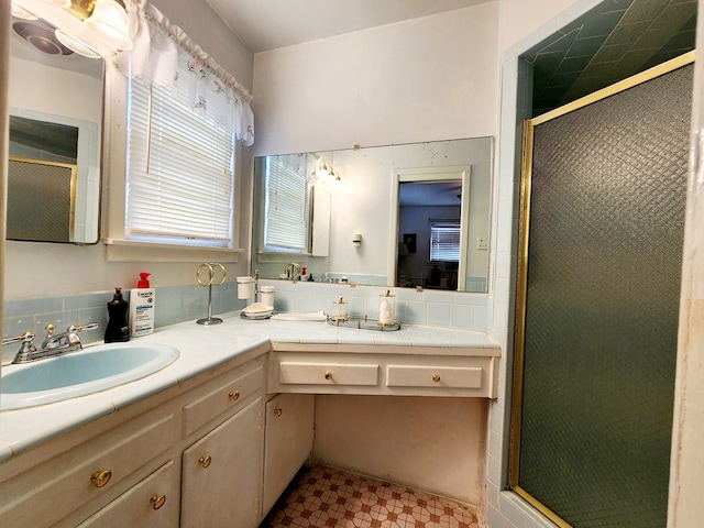 2104 Redbud Ave, Odessa, TX 79761 - full bath featuring a shower stall, vanity, and tile patterned floors