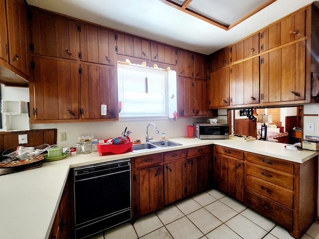 2104 Redbud Ave, Odessa, TX 79761 - kitchen featuring dishwashing machine, stainless steel microwave, a sink, light countertops, and light tile patterned floors
