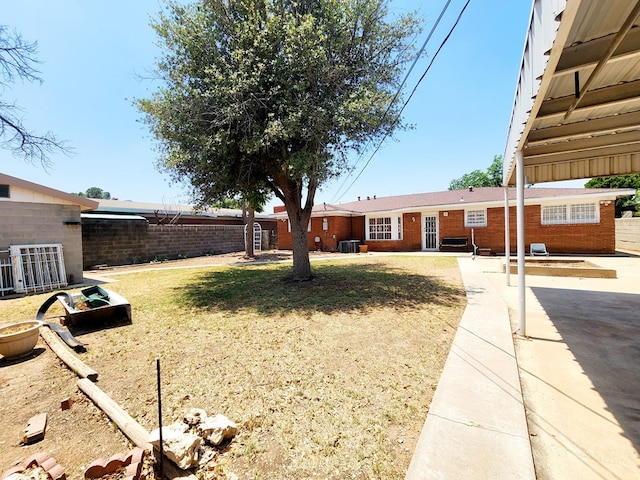 2104 Redbud Ave, Odessa, TX 79761 - view of yard featuring a patio and central AC unit