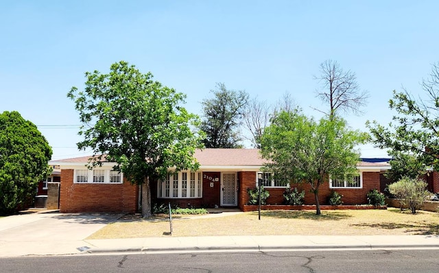 2104 Redbud Ave, Odessa, TX 79761 - single story home with concrete driveway and brick siding