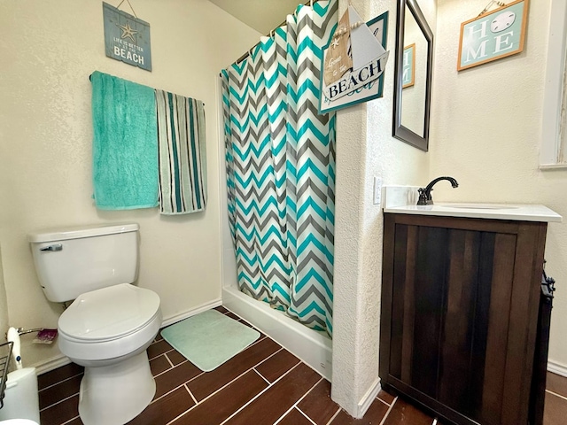 full bath featuring curtained shower, toilet, vanity, and wood finish floors