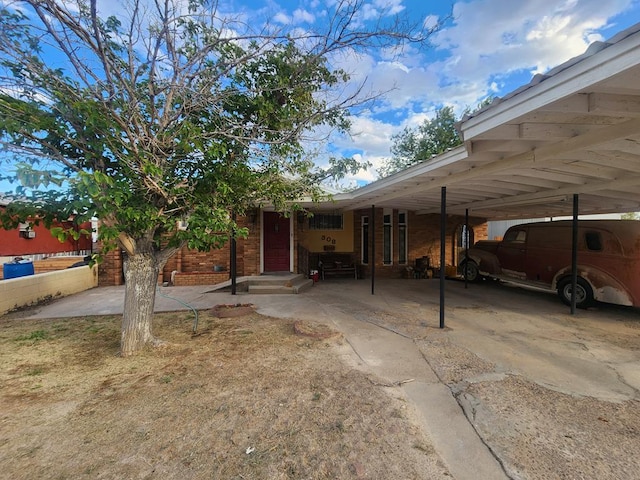 view of parking featuring a carport