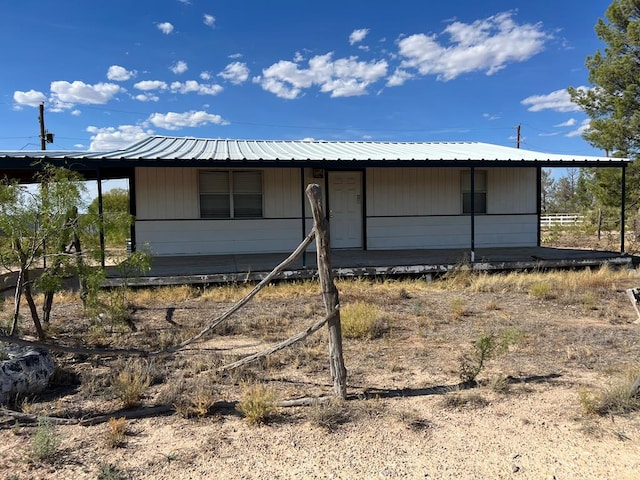 exterior space featuring metal roof