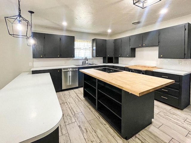 kitchen featuring open shelves, a sink, dark cabinetry, butcher block counters, and dishwasher