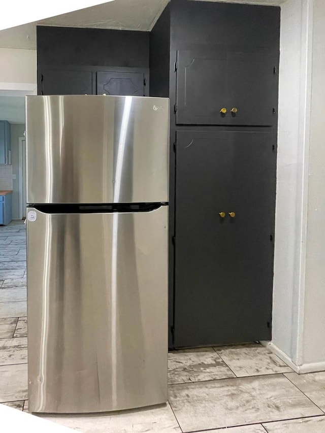 kitchen with freestanding refrigerator