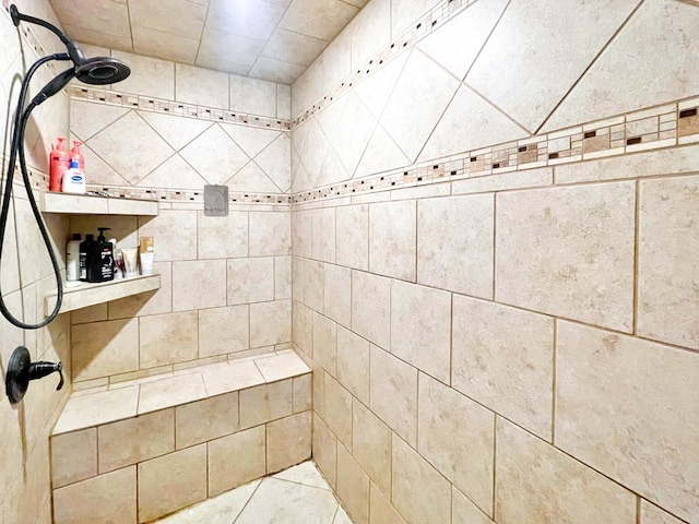 full bath featuring a tile shower