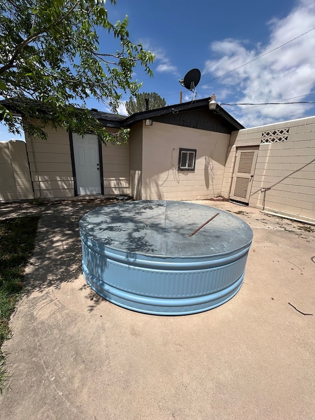 rear view of house featuring fence