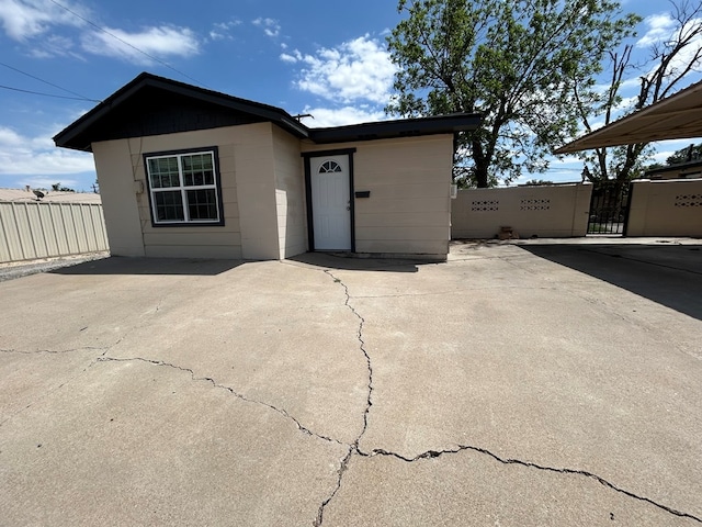view of front of property with fence and a gate