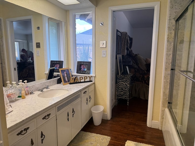 2500 Bainbridge Dr, Odessa, TX 79762 - ensuite bathroom featuring wood finished floors and vanity