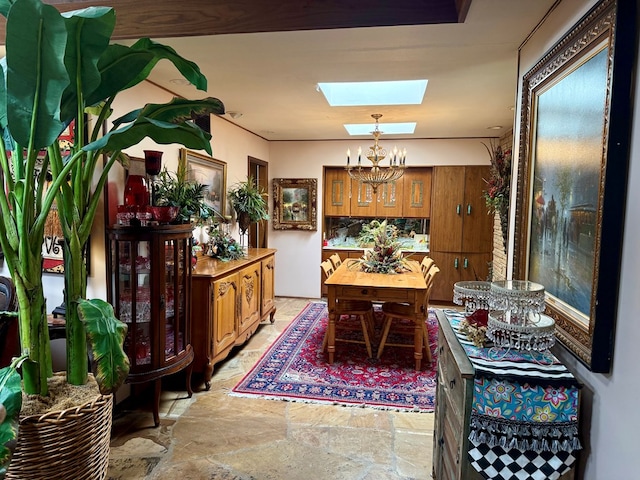 2500 Bainbridge Dr, Odessa, TX 79762 - dining area featuring a skylight, a chandelier, and light stone finish floors