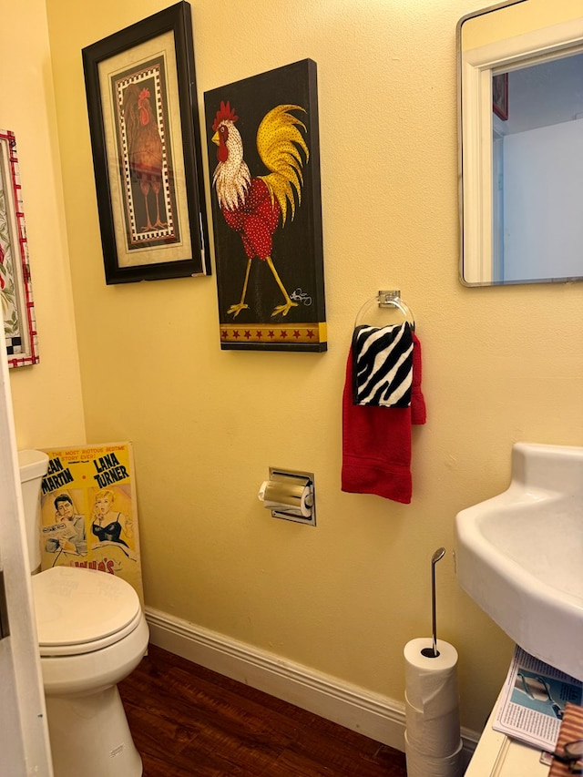 2500 Bainbridge Dr, Odessa, TX 79762 - half bath featuring wood finished floors and toilet