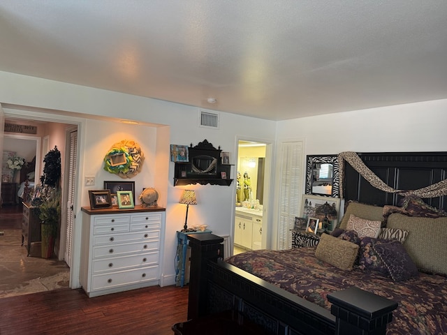 2500 Bainbridge Dr, Odessa, TX 79762 - bedroom with dark wood-style floors and ensuite bathroom