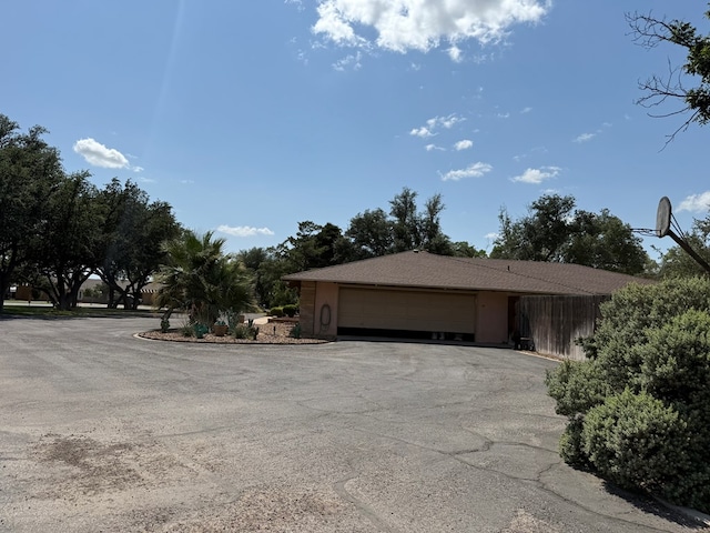 2500 Bainbridge Dr, Odessa, TX 79762 - view of property exterior featuring a garage and driveway