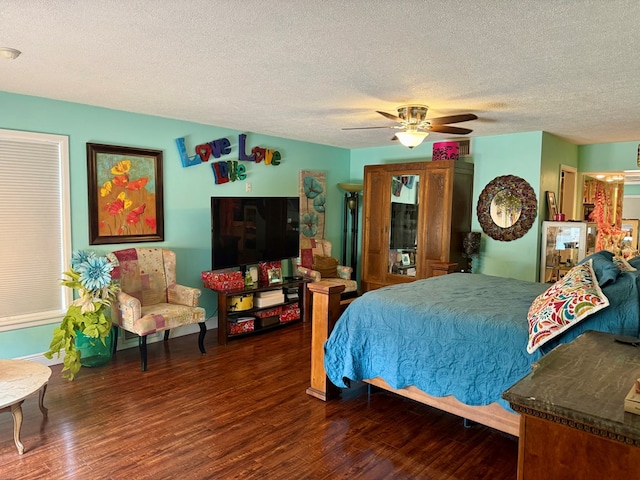 2500 Bainbridge Dr, Odessa, TX 79762 - bedroom featuring wood finished floors, a textured ceiling, and a ceiling fan