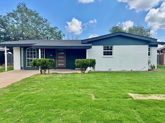 2816 Catalina Dr, Odessa, TX 79764 - view of front of property featuring brick siding, a front yard, and concrete driveway