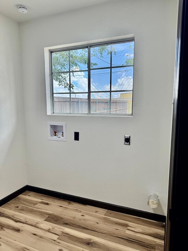 2816 Catalina Dr, Odessa, TX 79764 - laundry room featuring electric dryer hookup, light wood-type flooring, and hookup for a washing machine