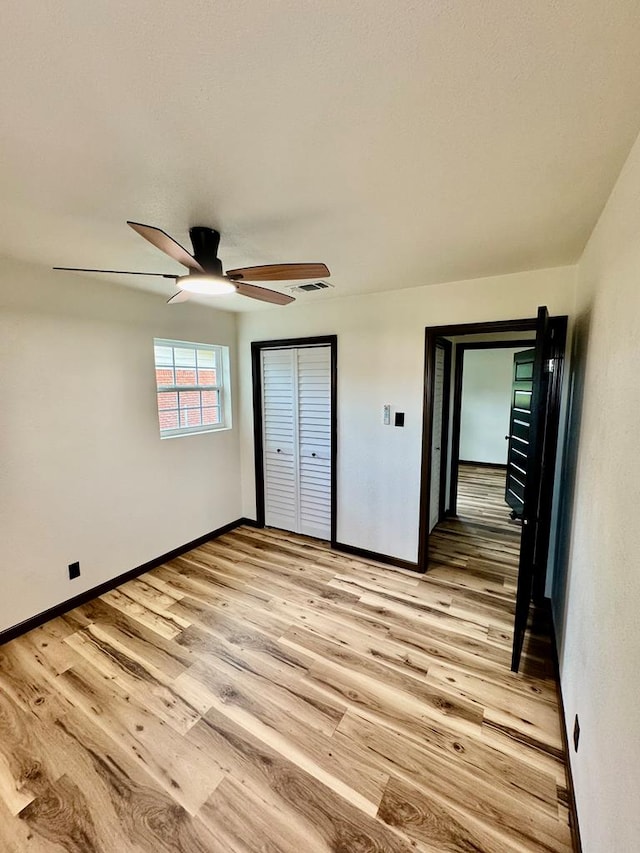 2816 Catalina Dr, Odessa, TX 79764 - unfurnished bedroom with light wood finished floors, a ceiling fan, and a closet