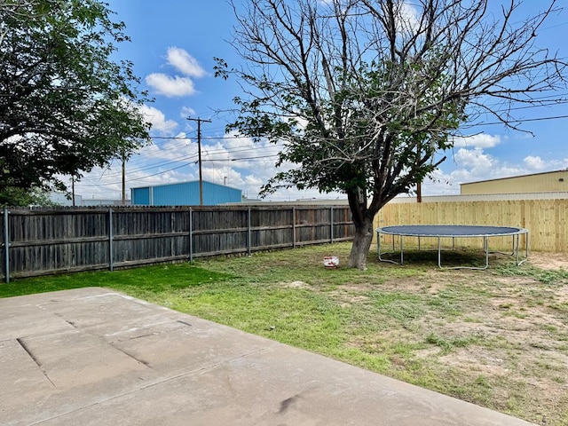 2816 Catalina Dr, Odessa, TX 79764 - fenced backyard featuring a trampoline and a patio area