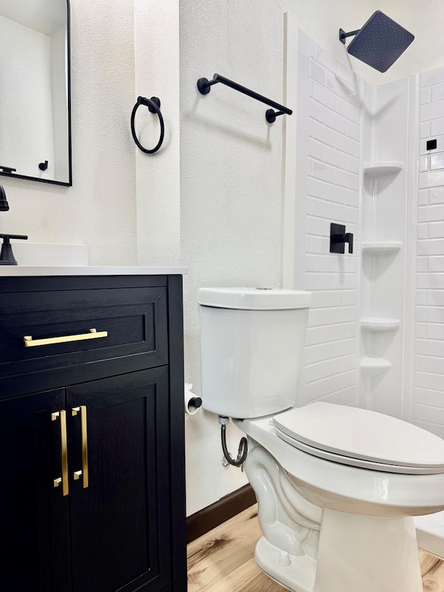 2816 Catalina Dr, Odessa, TX 79764 - full bathroom featuring wood finished floors, vanity, and a shower