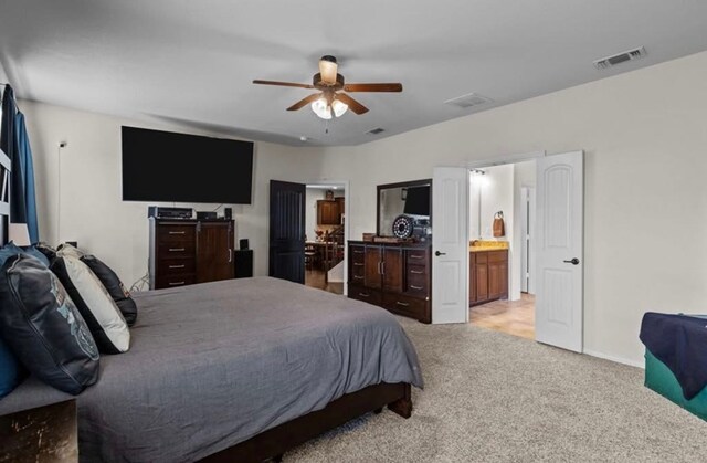 7012 Perot Ranch Rd, Odessa, TX 79765 - carpeted bedroom featuring a ceiling fan and ensuite bathroom