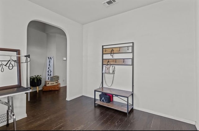 7012 Perot Ranch Rd, Odessa, TX 79765 - corridor featuring arched walkways, hardwood / wood-style flooring, and baseboards