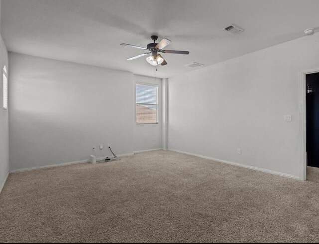 7012 Perot Ranch Rd, Odessa, TX 79765 - empty room featuring ceiling fan, carpet floors, baseboards, and a smoke detector