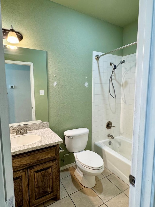 2909 Cagle Ln, Odessa, TX 79762 - bathroom with shower / bath combination, tile patterned floors, vanity, toilet, and a textured wall