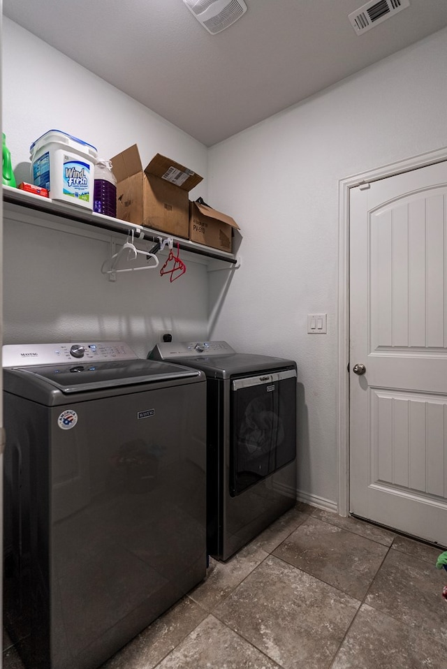 washroom with separate washer and dryer