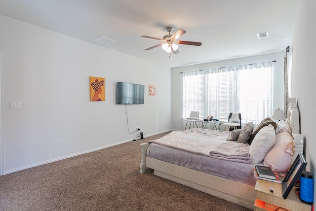 bedroom featuring ceiling fan and carpet