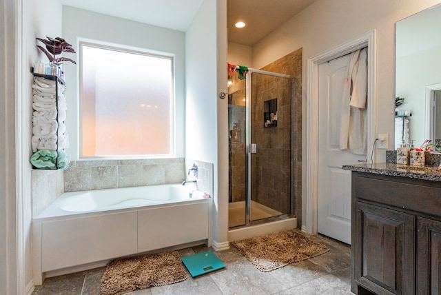 bathroom featuring vanity and shower with separate bathtub