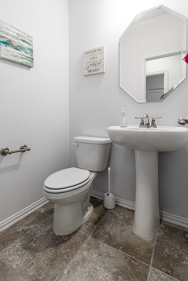 bathroom with sink and toilet